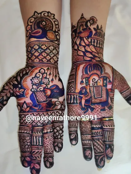 A colorful and artistic design, where I've added color to the henna to make the elephant and peacock motifs stand out.