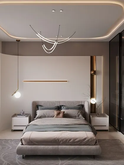 This ultra-modern bedroom features creative lighting solutions, including a curved ceiling light fixture and integrated accent lighting. A glass-paneled wardrobe adds to the sleek aesthetic, while the soft grey and beige tones keep the space feeling calm and restful.