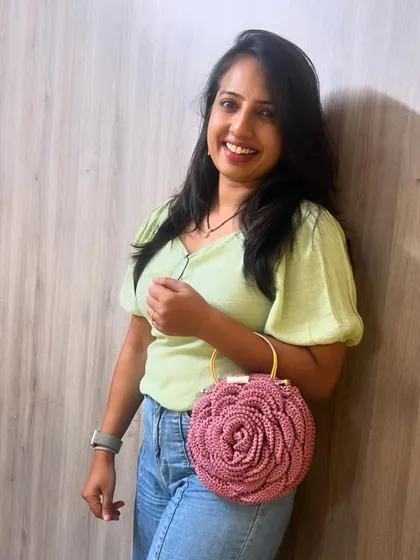 A full-length view of me with the dusty pink Rose Bag. It’s the perfect size to carry your essentials in style.