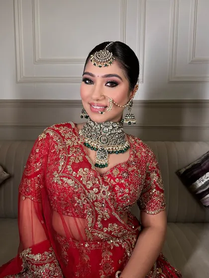 A happy and smiling bride, looking absolutely ethereal in her complete bridal look from Rimaya.