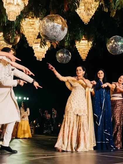 The bride and her friends in a fun, pointing gesture during their dance. It's these small, playful details that make a performance memorable.