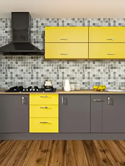 A cheerful and modern straight-line kitchen that pairs bold yellow drawers and wall cabinets with neutral grey. This color combination, along with the mosaic tile backsplash, creates a playful and energetic atmosphere.