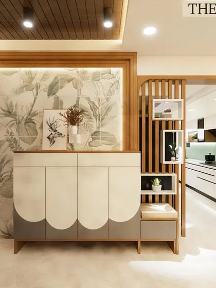 This foyer design required careful coordination. We executed the installation of the wooden slat partition, the custom-designed scalloped console, and the botanical wallpaper, ensuring all three distinct elements align perfectly.