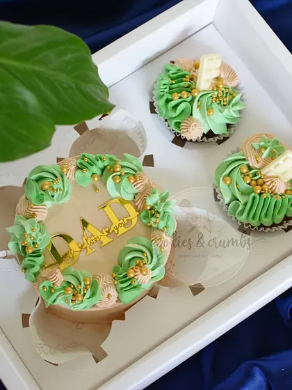 A Father's Day gift set in a fresh green and beige color scheme. This box includes a mini cake and two coordinating cupcakes.