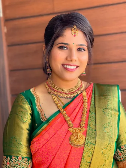 Gagana looking lovely for her welcome ceremony. This photo highlights the clean, traditional makeup and simple updo that perfectly matches her classic attire.