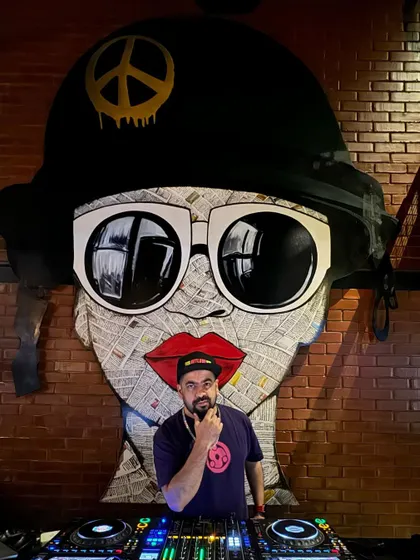 Posing in front of some cool street art. The visual culture is a big part of the vibe I curate.