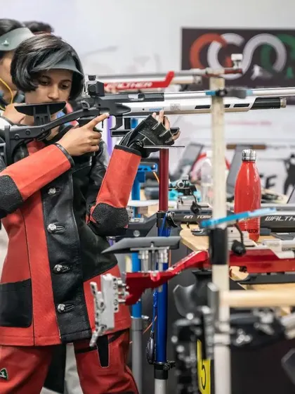 Young athletes in their shooting jackets, learning the proper stance and technique.