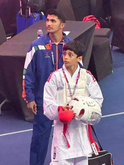 A quiet moment between coach and student before a big fight. My role is to guide, support, and ensure my students are mentally and physically prepared.