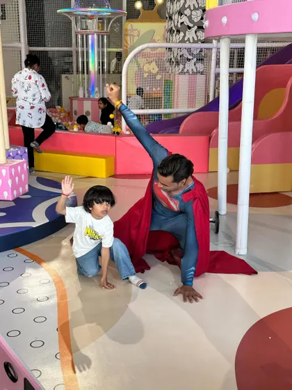 Another shot of our Superman mascot posing with the birthday boy, creating a treasured memory.
