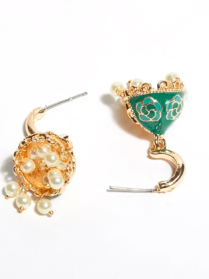 These green enamel jhumkis don't just hang, they sing. They are designed to be lightweight and to oscillate beautifully, with delicate pearls that add to their charm. More colors are available.