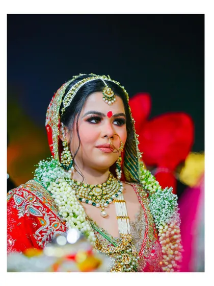 A candid portrait of the bride during the wedding ceremony, her face lit with happiness. This shot captures the genuine emotion of the moment.