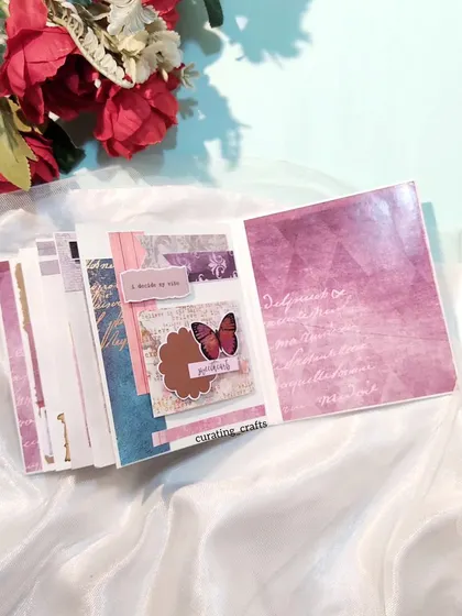 A page with a butterfly embellishment from the vintage mini scrapbook.