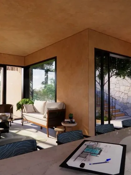 An open-plan kitchen and living area in the Earth Abode project, designed to maximize views of the surrounding landscape from every corner.