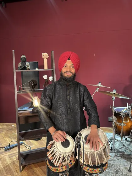 Ready for a music video shoot in a Mumbai studio. I am comfortable in front of the camera and enjoy the process of bringing music to life visually. Whether it's a classical piece or a fusion track, I bring my best tablas and my full dedication to the set.