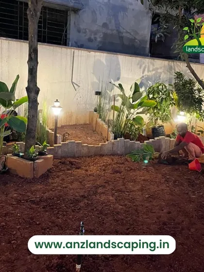 Our work continues after sunset. Here, we are installing and testing garden lighting, an essential feature for creating ambiance and ensuring safety.