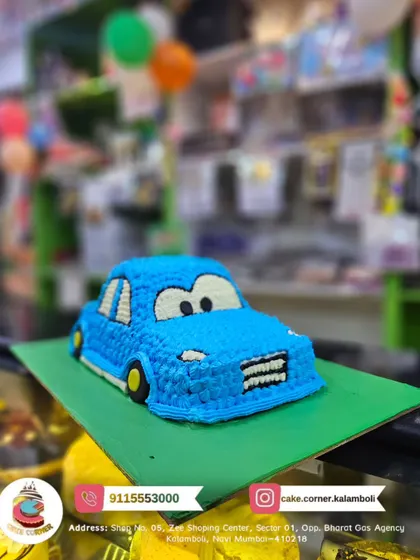A fun, shaped cake that looks just like a blue car. This creative design is sure to be a hit with any kid who loves to play with toy cars.