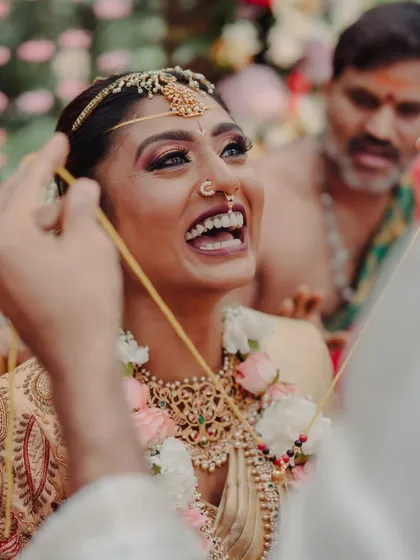 Another angle of the bride's infectious laughter during the ceremony. These candid moments are what make a wedding truly special and memorable.