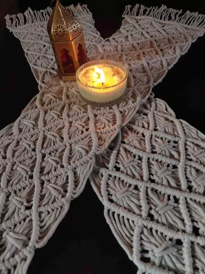 Another view of our macrame table mat, perfect for creating a warm and inviting tablescape. The natural cotton material adds a lovely, rustic texture.