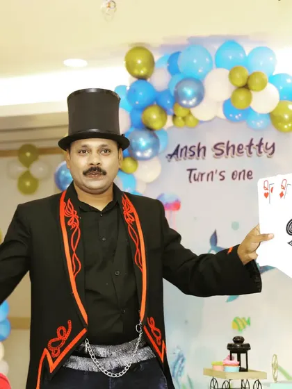 Displaying a royal flush during a card manipulation routine. I perform with both regular and jumbo-sized cards to make sure the magic is visible to everyone.