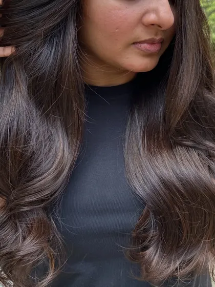 A close-up of the healthy, shiny 'Cocoa Bean' hair.