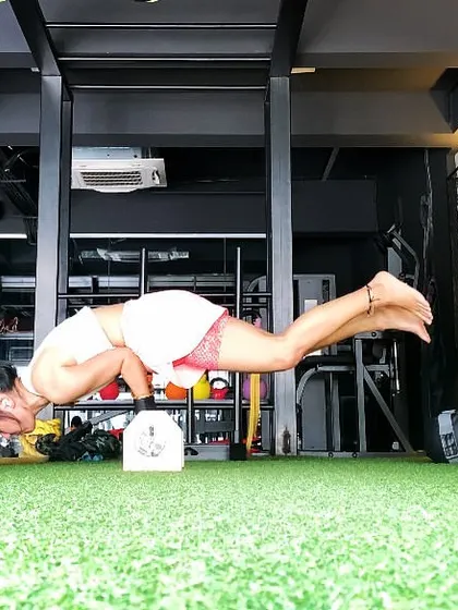 Ending a session with Mayurasana, or peacock pose. This powerful arm balance strengthens the digestive system and tones the entire body.
