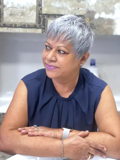A classic and creative take on shades of grey. This client looks stunning with her silver pixie cut, a testament to how artful color can be.