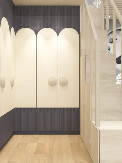 The arched wardrobe doors and integrated staircase to the loft bed add a touch of architectural fun to this creative kids' room.