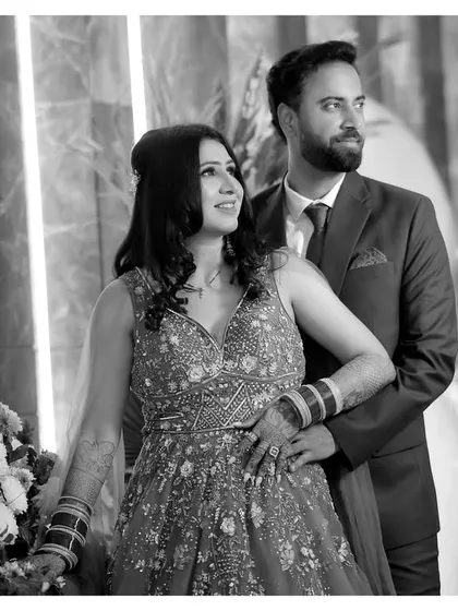A duplicate of the previous classic black and white portrait, reinforcing its timeless appeal and the couple's elegant pose.