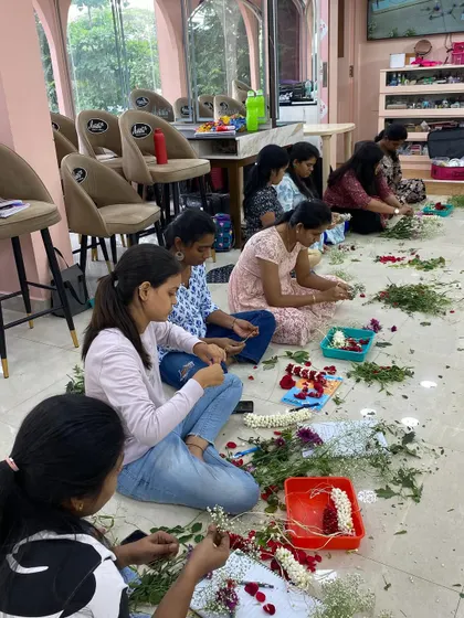 More hands-on practice during our styling class, where students learn to create intricate floral accessories.