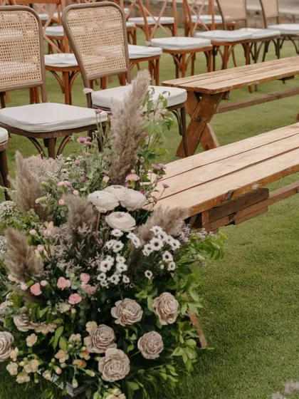 A mix of chairs and benches provides varied seating for guests.