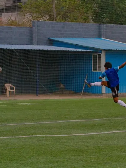 An explosive moment of athleticism as a player connects with the ball mid-air. Our training develops the physical conditioning required for such dynamic plays.