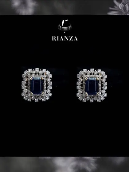 The changeable earrings shown with a deep blue sapphire. This demonstrates how one pair of earrings can be adapted for four completely different looks and color schemes.