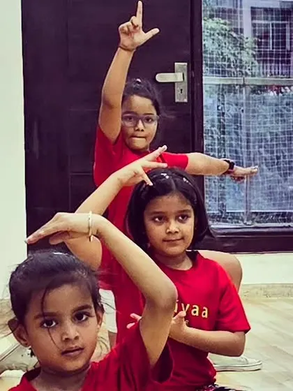 Our youngest dancers striking a pose in their Trikayaa t-shirts during a fun Bollywood dance session.