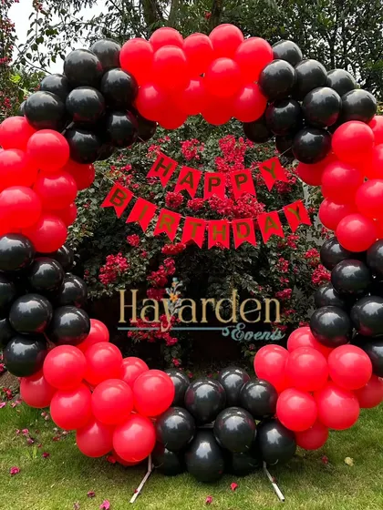 Another angle of the red and black outdoor balloon ring, showing its vibrant contrast with the background.