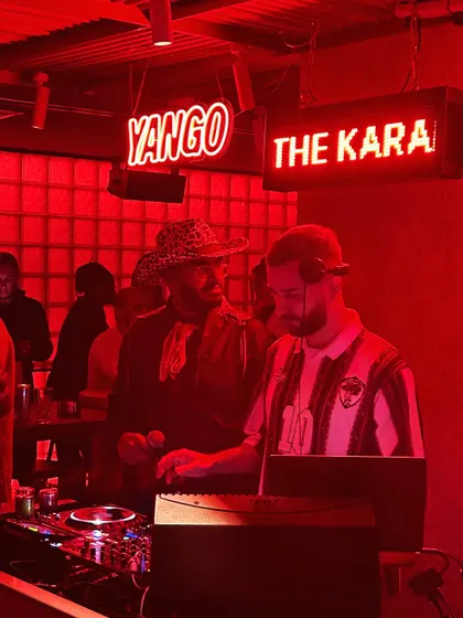 In the booth at a club in Dubai, with the red lights setting the mood. I adapt my sound to fit the venue, from underground clubs to slick city bars.