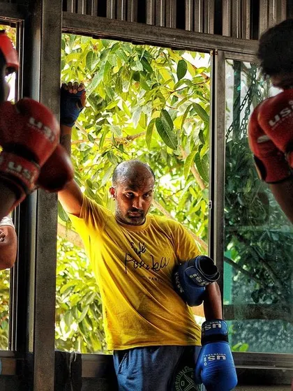 Taking a moment between rounds. Even when you're tired, you have to stay focused and listen to your corner.