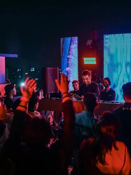 The view from the console at Agent Jacks in Bhopal. A packed rooftop, hands in the air, and pure love for the music.