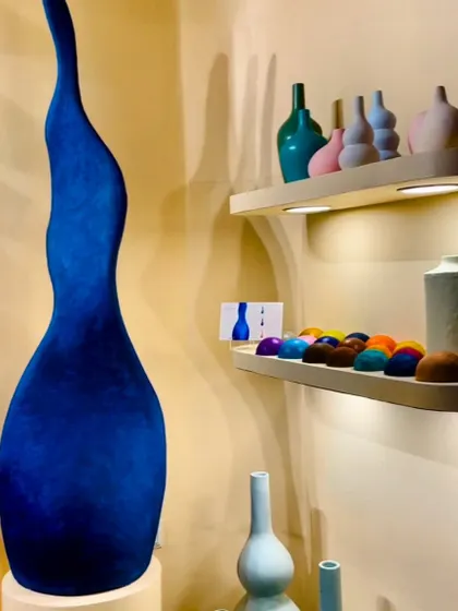Beautifully crafted ceramic and pottery pieces on display. We love incorporating such organic shapes and rich colors into our projects to add a touch of authenticity and artistic flair.