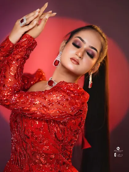 A bold and glamorous look in red on a dusky model, showing that any color can look stunning with the right application.