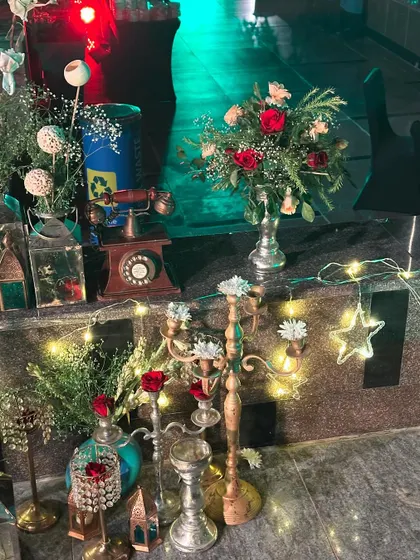 Detail shot of the decor at the Le Méridien corporate event, featuring vintage props like an old telephone and candelabras.