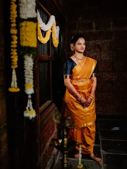 A beautiful shot of the bride in a traditional setting. The makeup looks stunning in the low light.