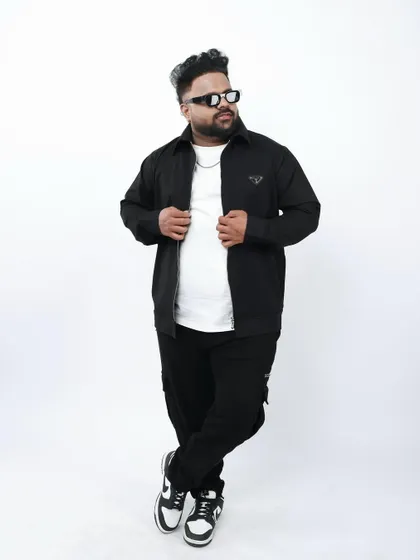 A full-length studio shot showcasing my personal style. My look is part of the DJ Panda persona, blending streetwear with a confident attitude.