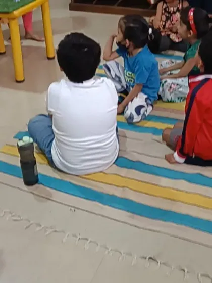 A young listener watches intently, captivated by the classic story being told.