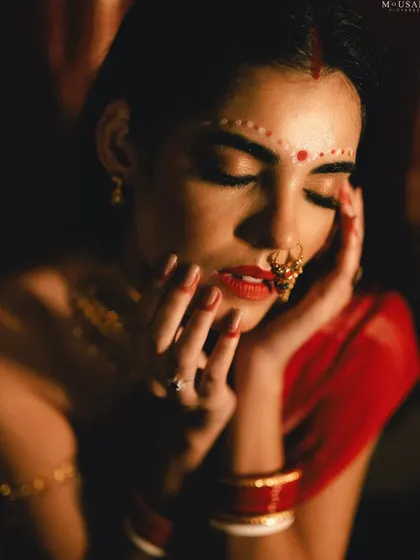 A close-up from the Odia bride editorial shoot. The focus is on her traditional makeup, jewelry, and serene expression, capturing the essence of bridal beauty.