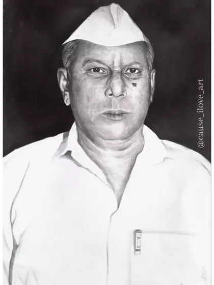 A formal A3 pencil sketch of a man wearing a traditional Gandhi cap, created as a memorial portrait. The dark background helps the subject stand out.
