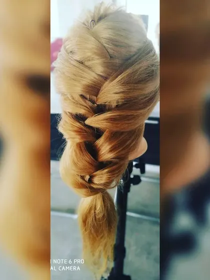 A classic side-swept fishtail braid. This is a timeless and versatile hairstyle that can be dressed up or down for any occasion, from a casual day out to a formal party.