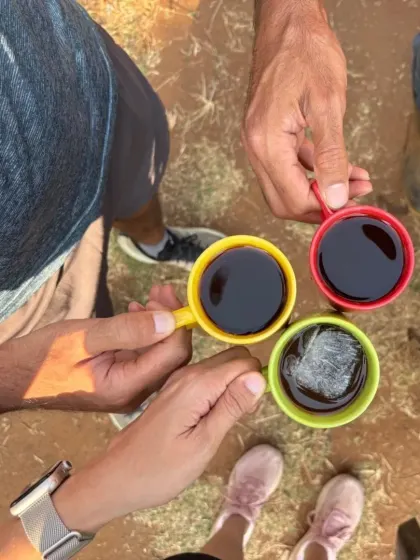 Sharing a cup of black coffee with friends right here on the estate. This is the ultimate reward: enjoying the final product of our hard work together, right where it was grown.