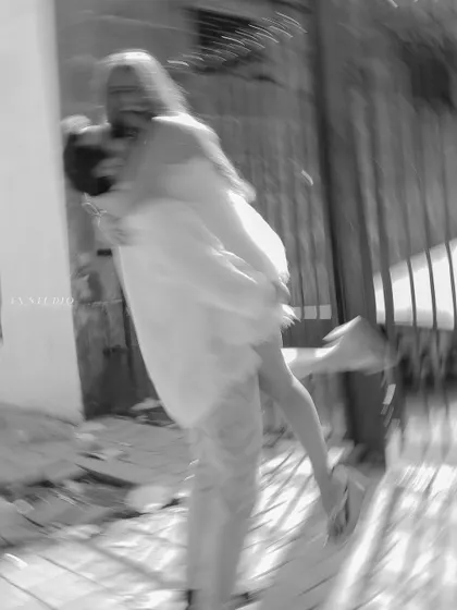 An artistic, motion-blurred shot in black and white, capturing the dizzying, joyful feeling of being in love.