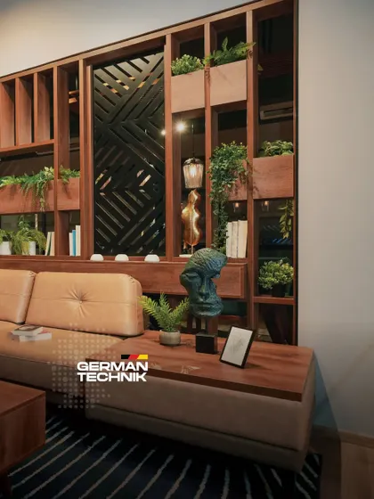This living room, with its unique wooden partition and biophilic elements, showcases how I make luxury simple and effortlessly livable by blending premium materials with timeless design.