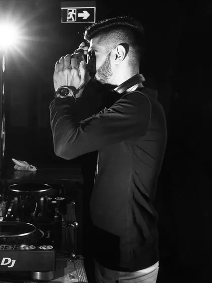 A black and white shot capturing a moment of focus at the console. It's in these quiet moments that I plan the next big track to drop.